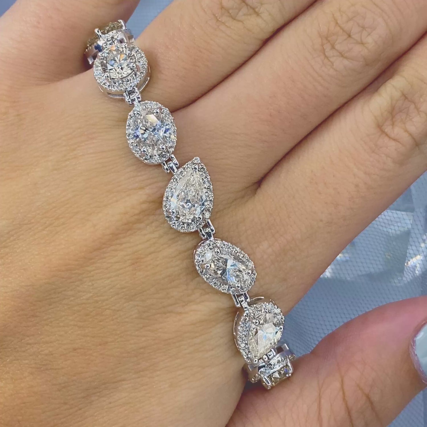 Certified 17.30CT Round, Pear, and Oval cut Diamond Bracelet in 18KT White Gold