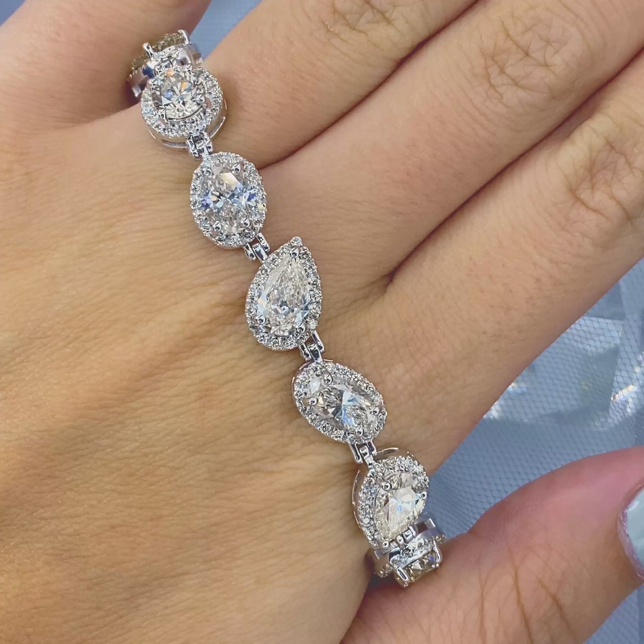 Certified 17.30CT Round, Pear, and Oval cut Diamond Bracelet in 18KT White Gold