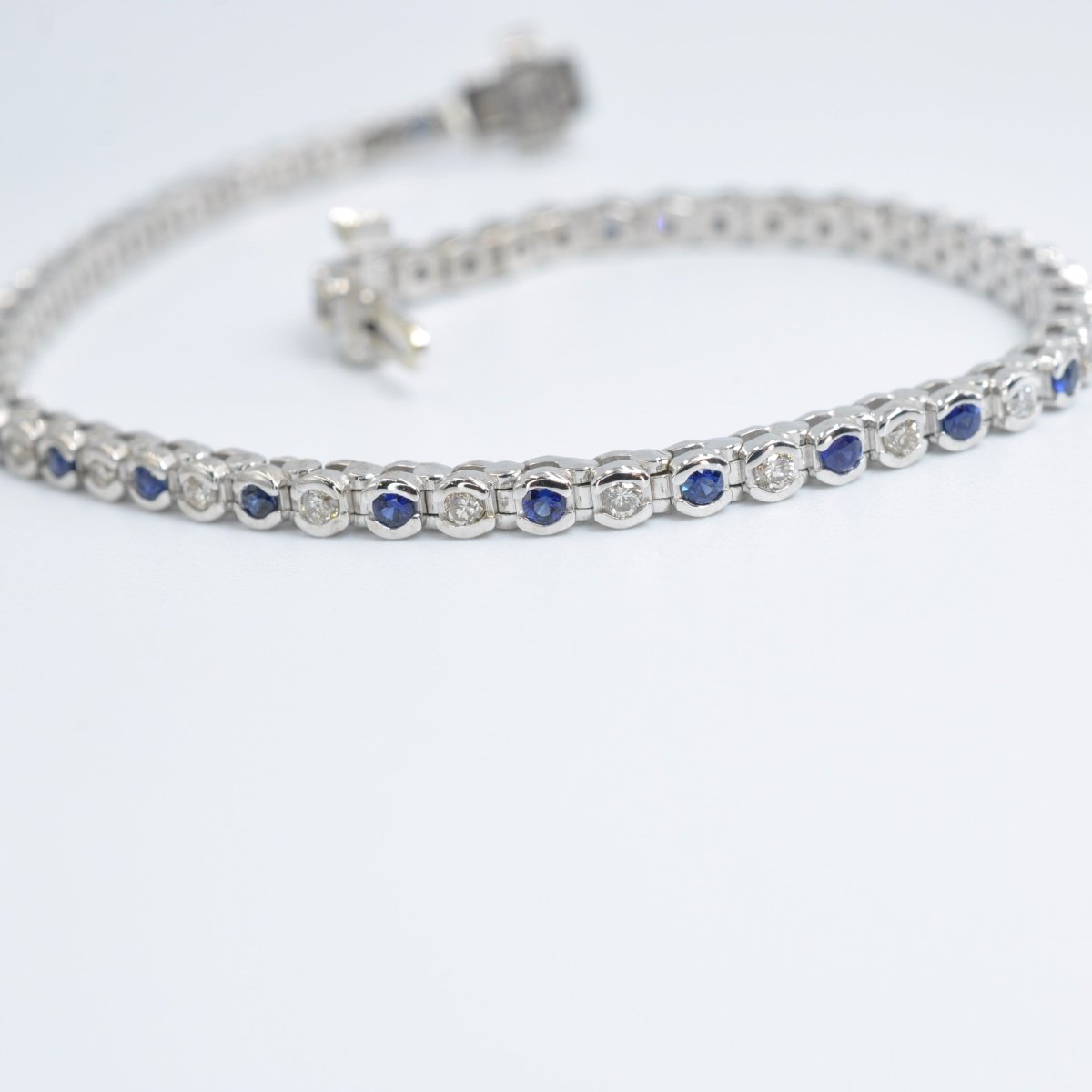 Enchanting 1.00 CT Round Cut Blue Sapphire and Diamond Color Stones Bracelet in 14KT White Gold