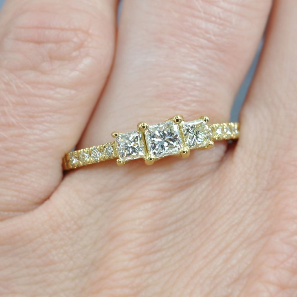 Fashionable 1.10 CT Princess and Round Cut Diamond Three Stone Ring in 18 KT Yellow Gold