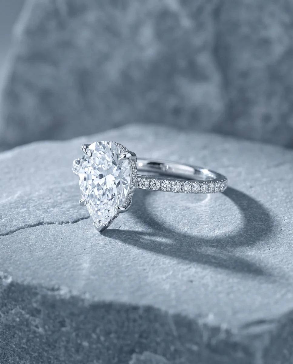 The finished pear-shaped diamond engagement ring in white gold