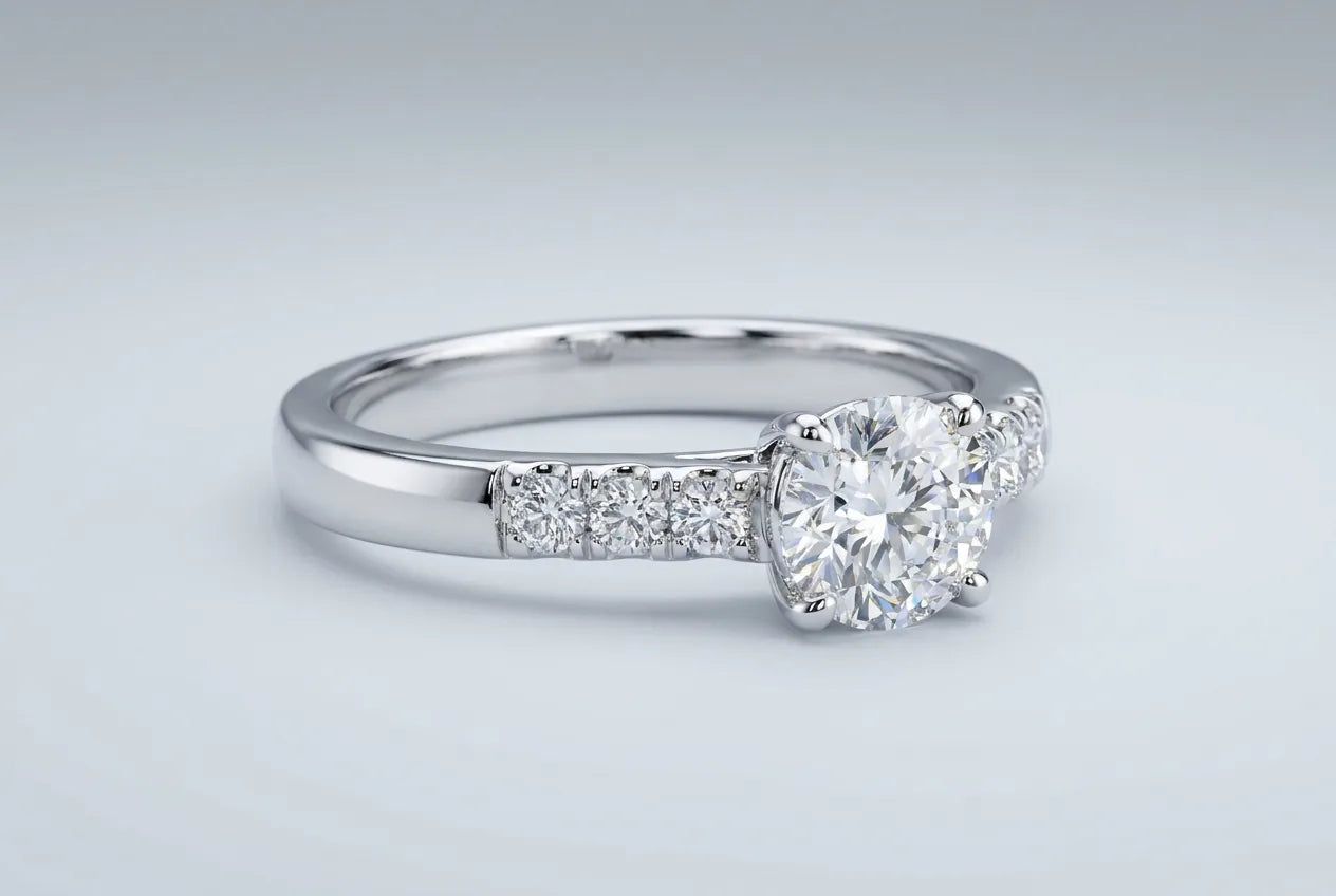 A polished white gold diamond ring with a bright mirror finish