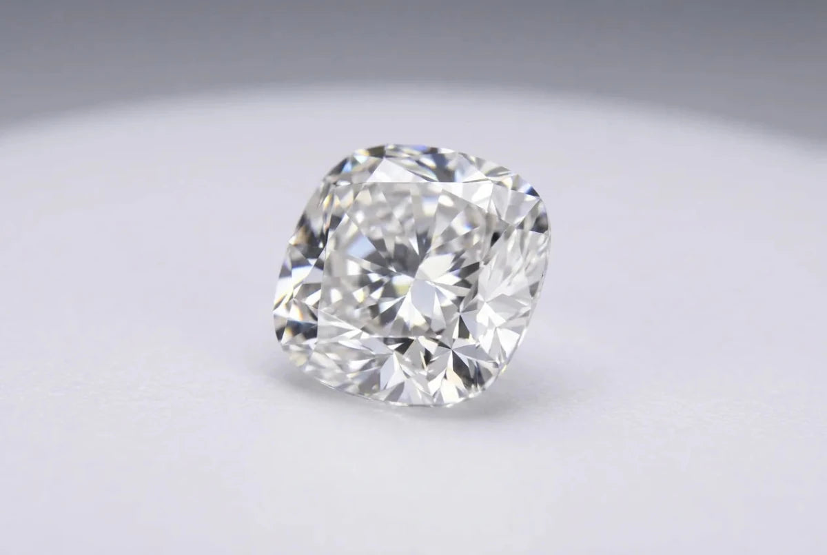 A loose cushion cut diamond with softly rounded corners