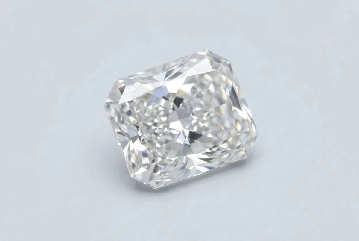 A loose radiant cut diamond, a rectangle with trimmed corners