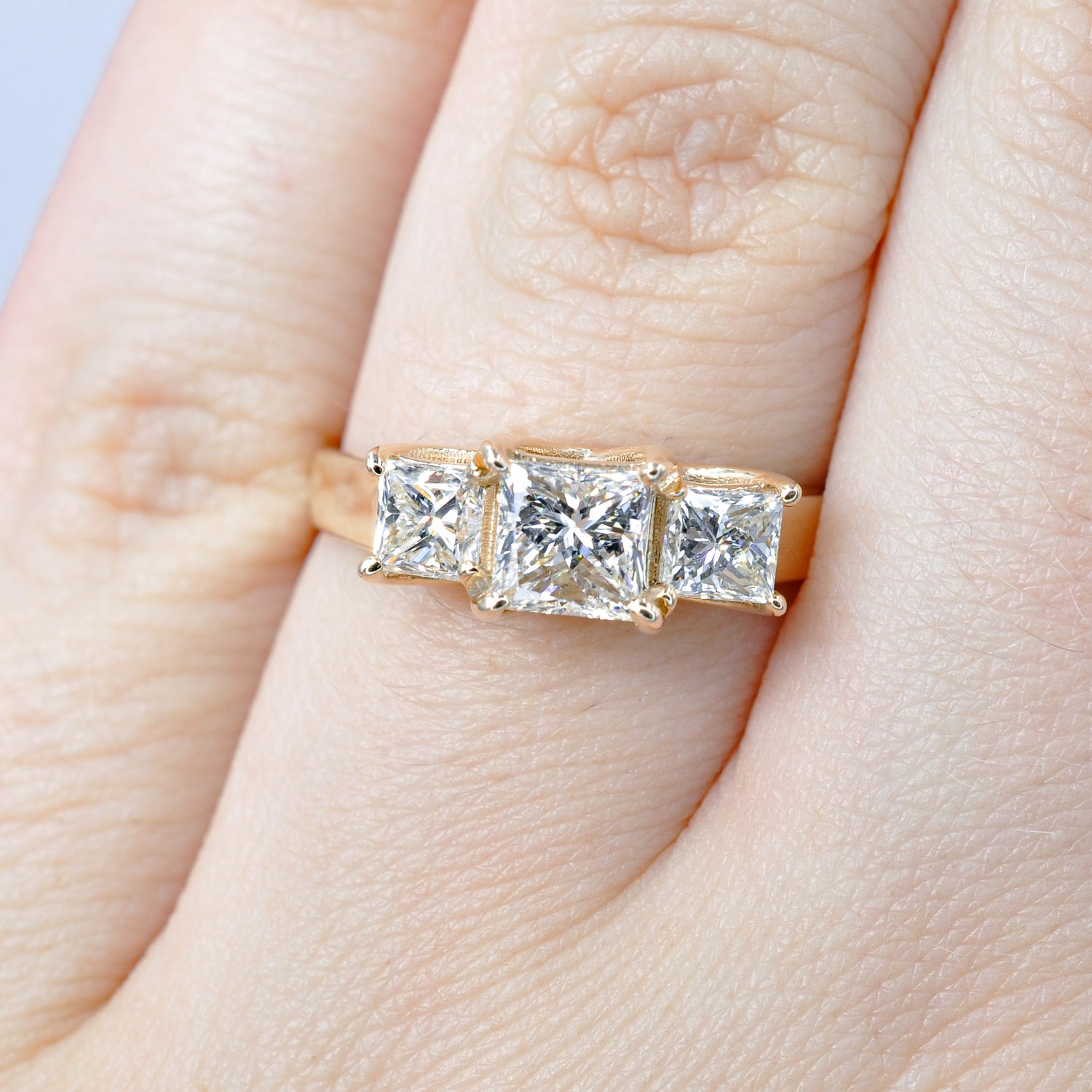Alluring 1.50 CT Princess Cut Diamond Three Stone Ring in 14KT Yellow Gold