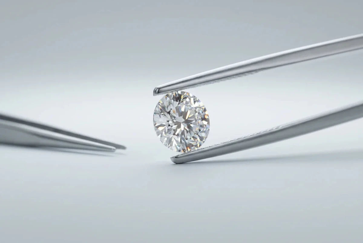 Lab-grown diamond held in tweezers