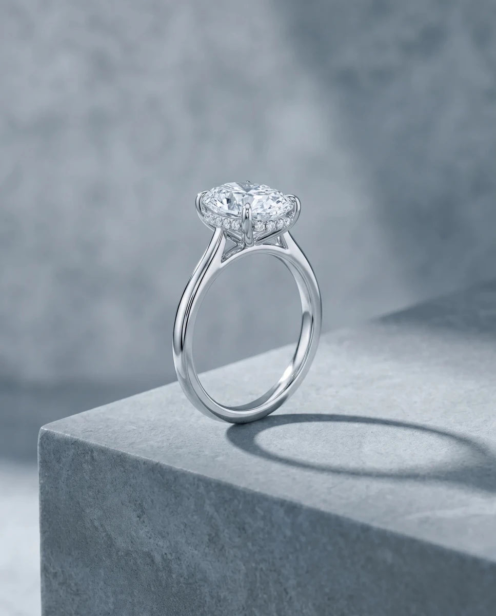 The finished custom oval diamond engagement ring in white gold