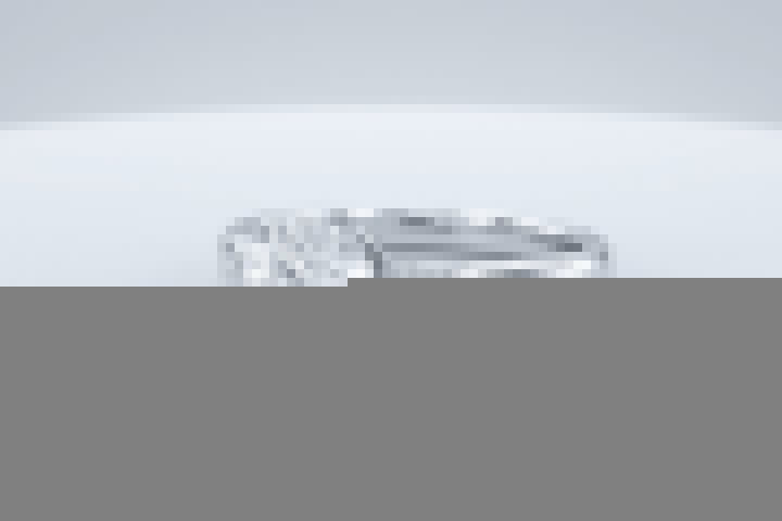 A white gold engagement ring with a round center stone