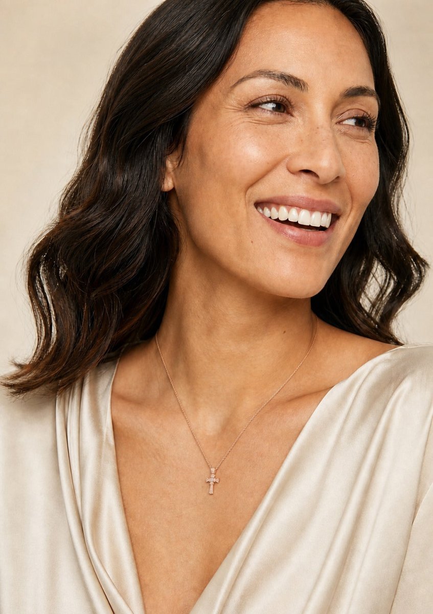A woman wearing a rose gold diamond pendant