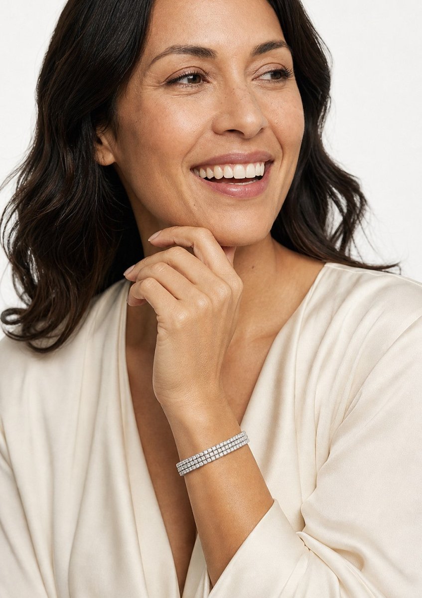 A woman wearing a white gold diamond bracelet