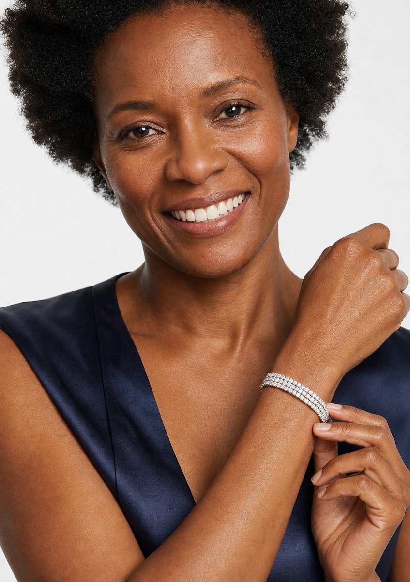 A woman wearing a white gold diamond bracelet