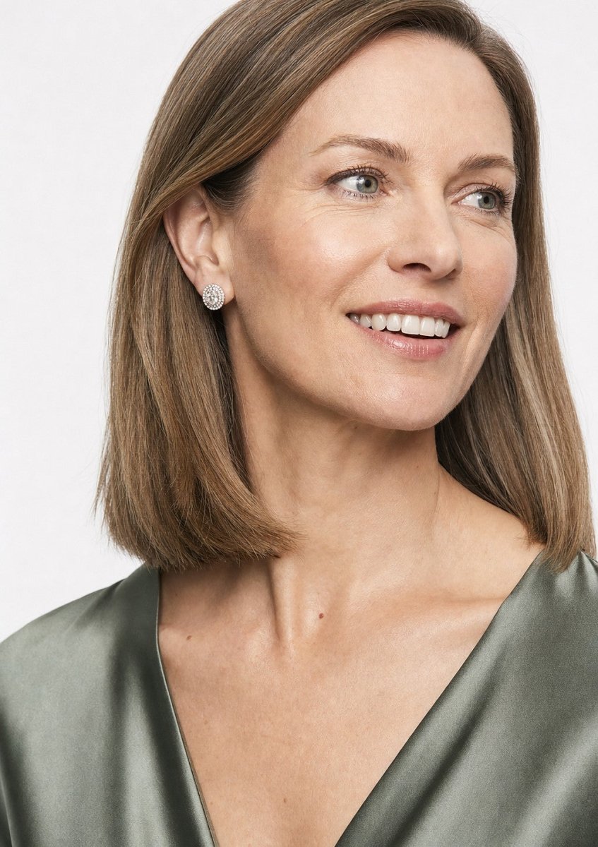 A woman wearing a white gold diamond pair