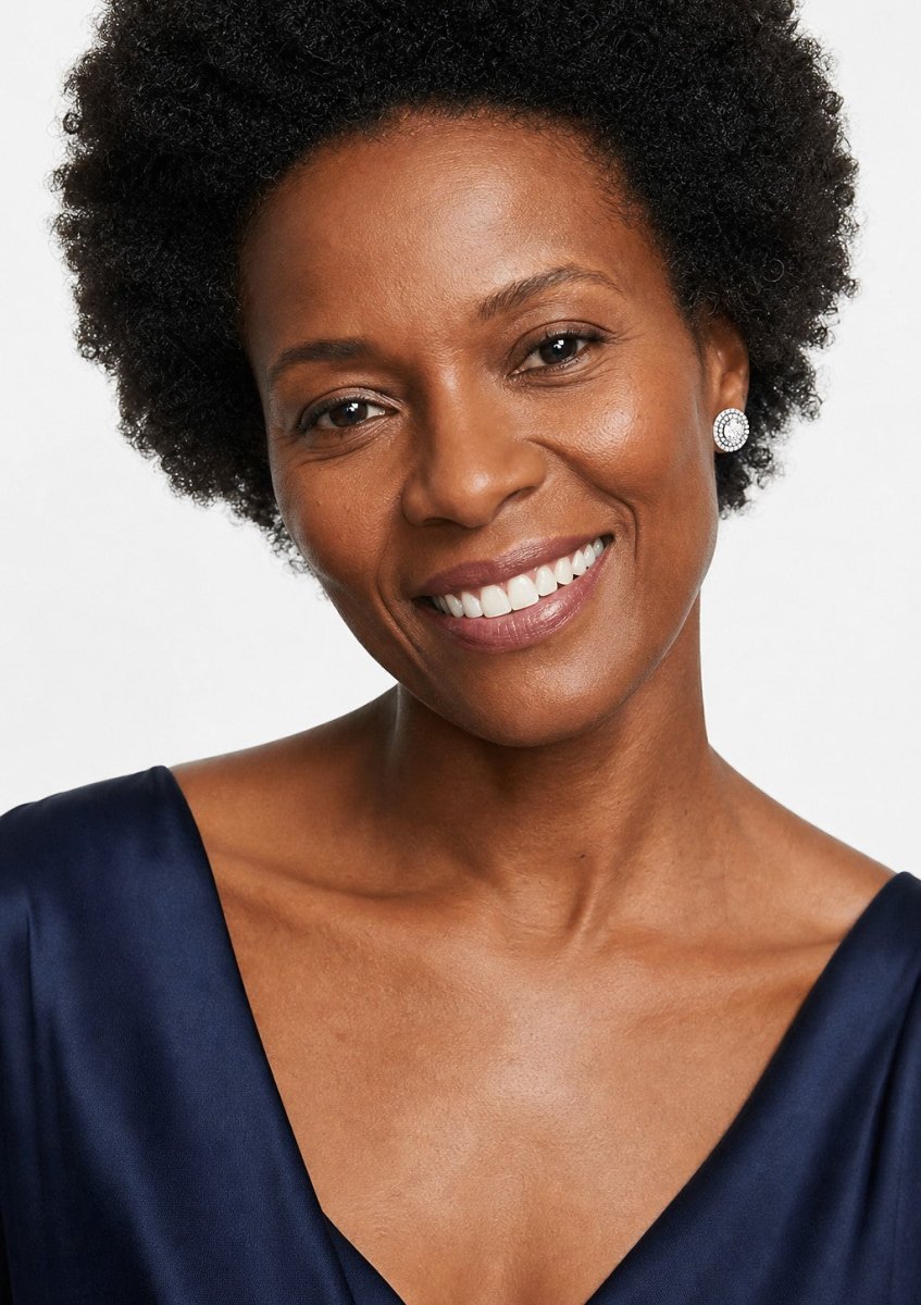A woman wearing a white gold diamond pair
