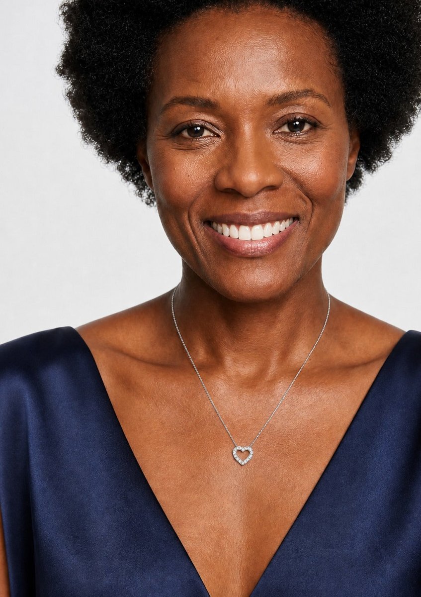 A woman wearing a white gold diamond pendant