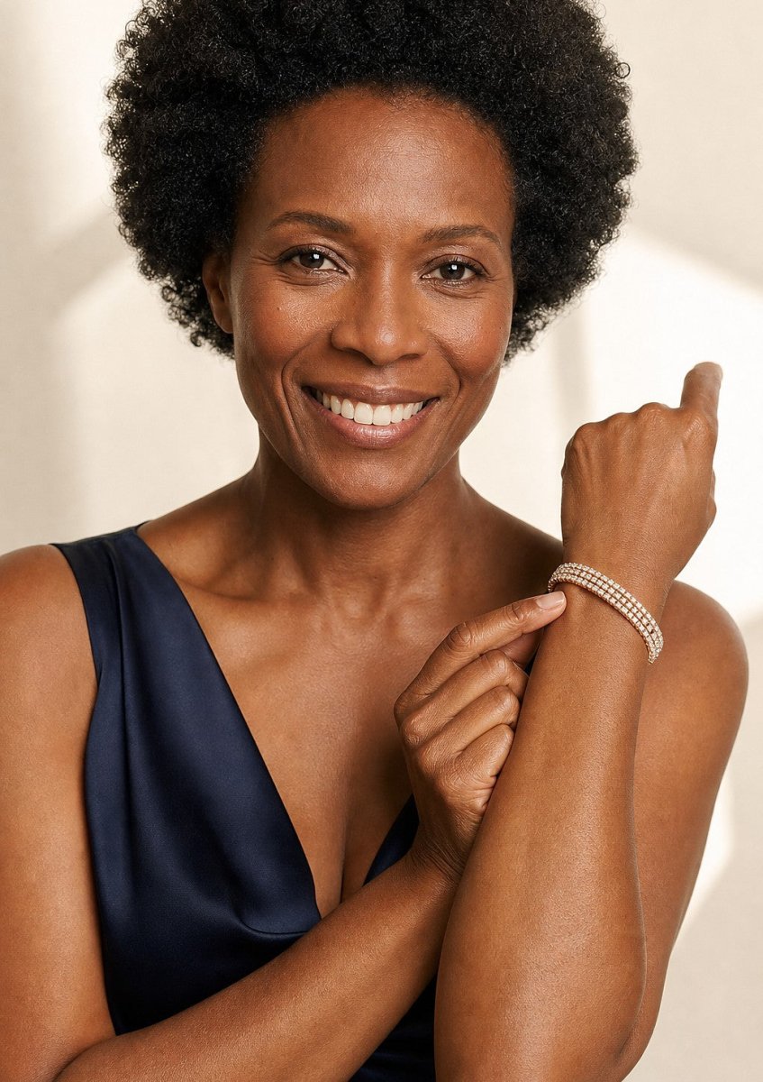 A woman wearing a yellow gold diamond bracelet
