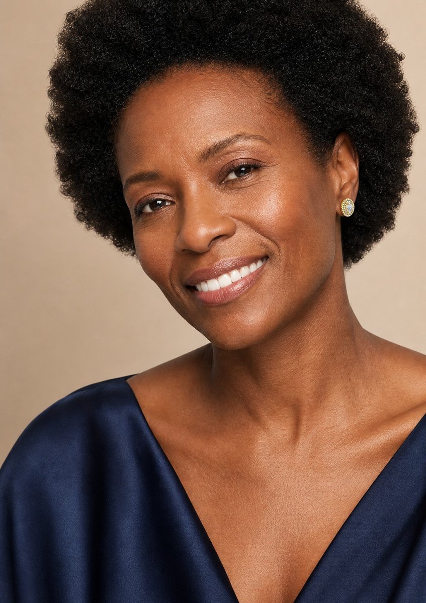 A woman wearing a yellow gold diamond pair