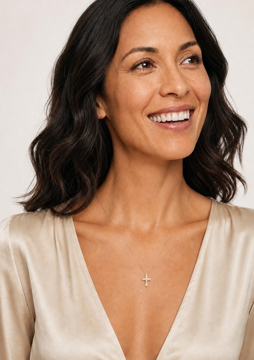 A woman wearing a yellow gold diamond pendant