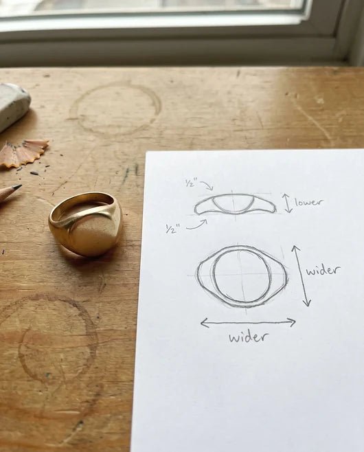 A phone photo of a worn vintage signet ring beside a pencil sketch of a lower, wider version