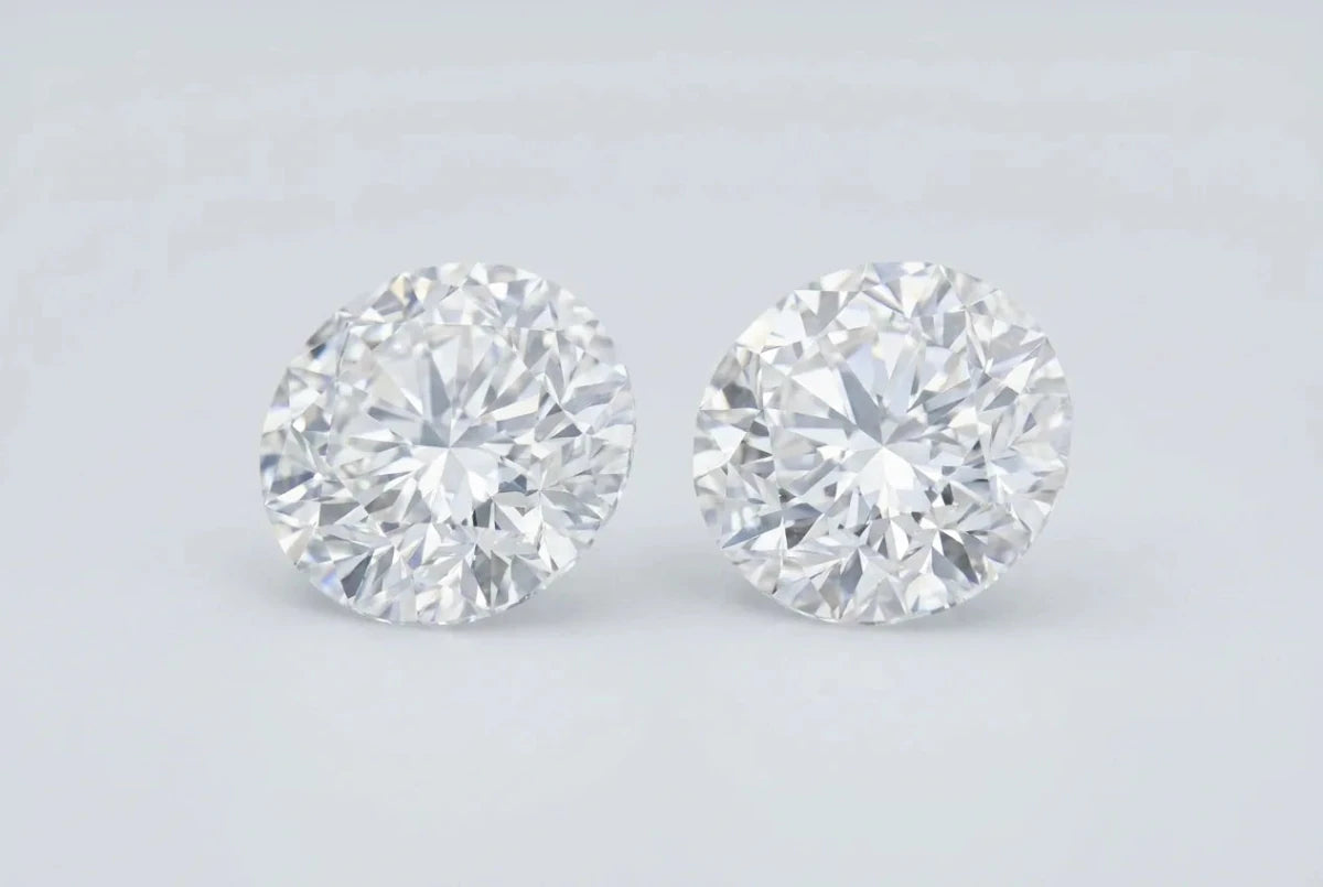 Two identical round brilliant diamonds side by side