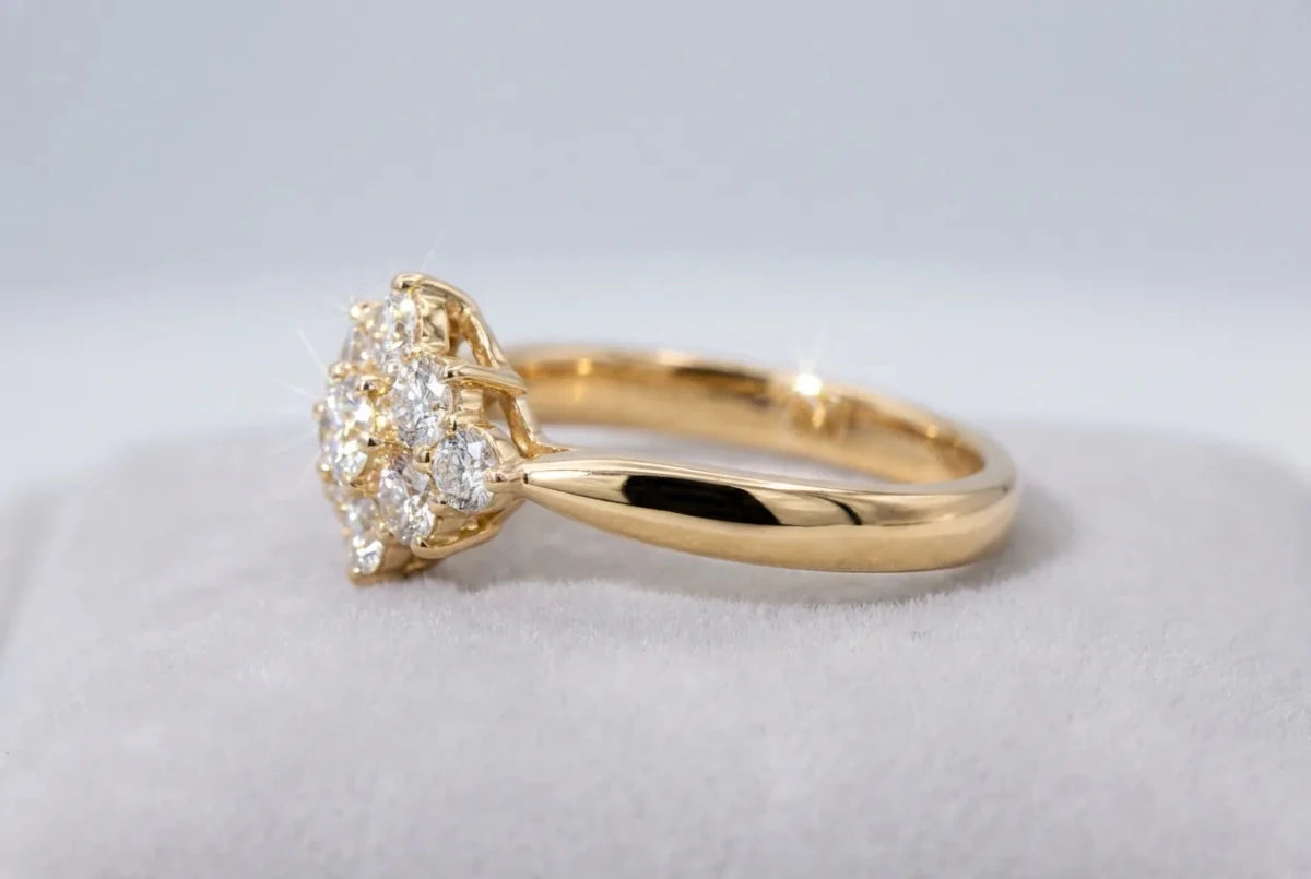 A polished yellow gold diamond ring in a warm golden tone