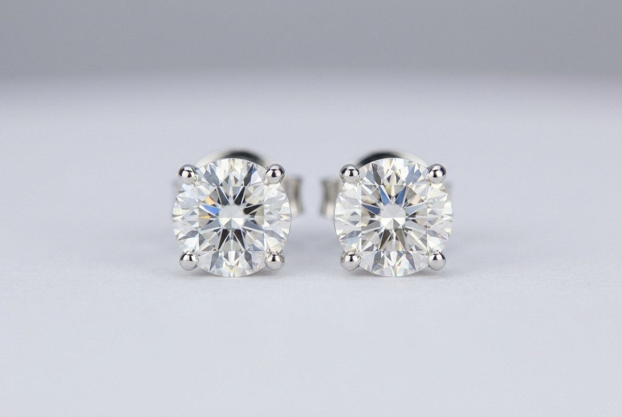 A pair of custom diamond stud earrings