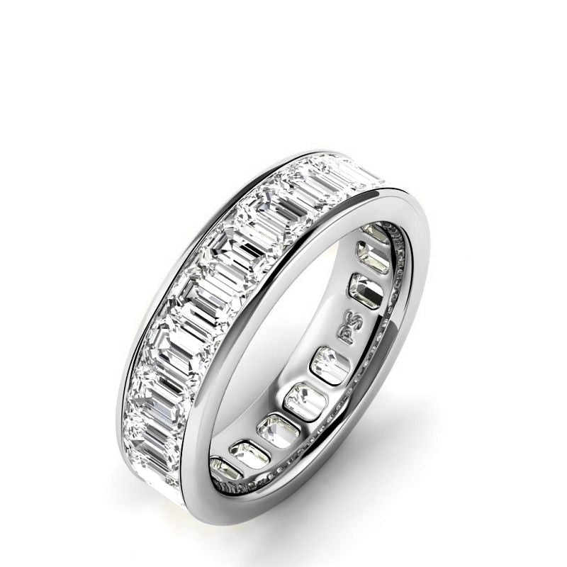 An emerald cut diamond eternity band in white gold