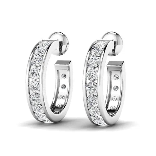 A pair of channel-set diamond hoop earrings in white gold