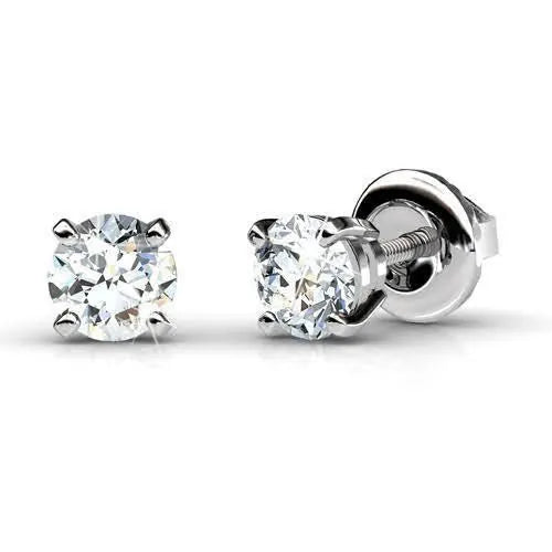 A pair of round diamond stud earrings in white gold
