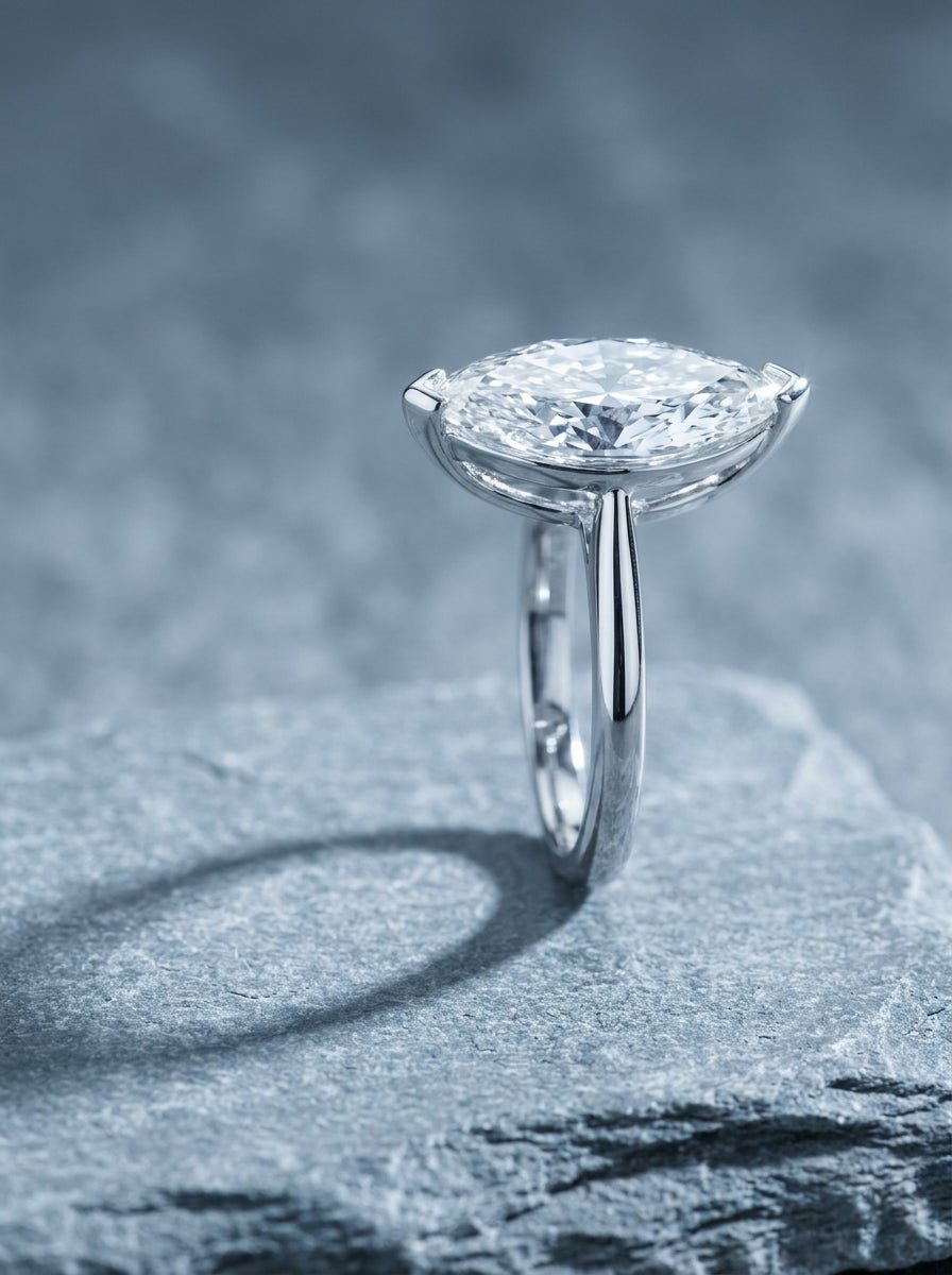 White gold solitaire ring with a marquise cut diamond