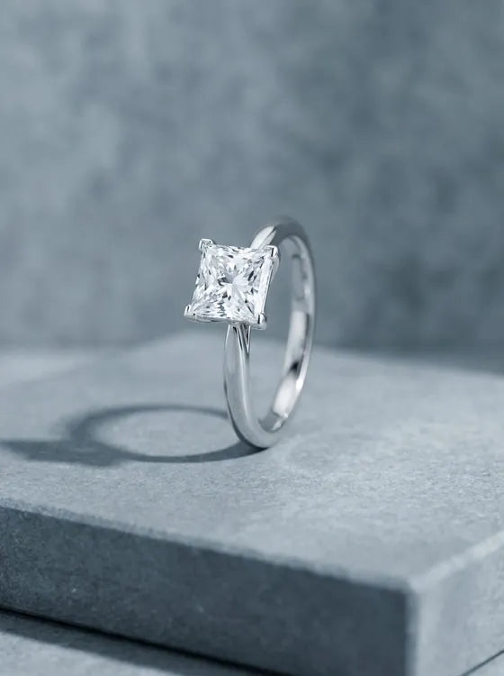 White gold solitaire ring with a princess cut diamond
