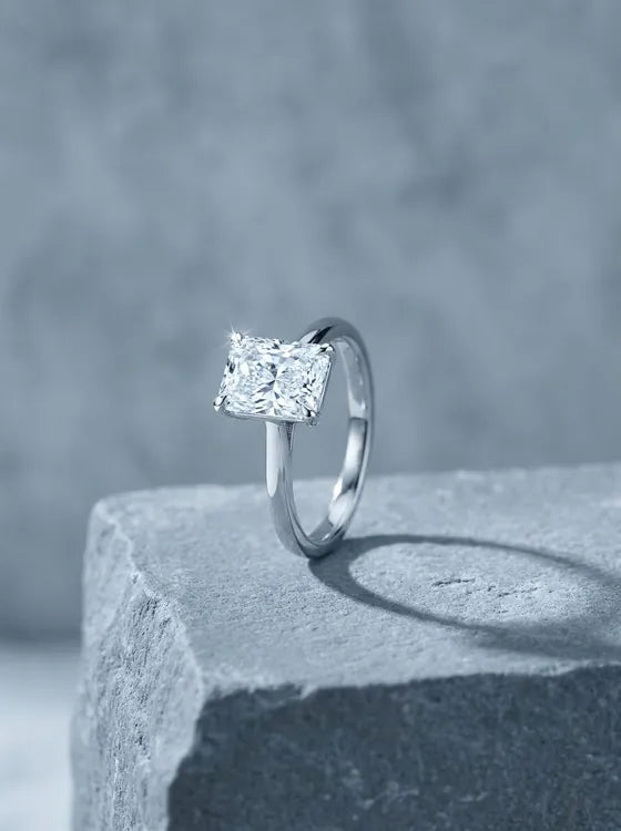 White gold solitaire ring with a radiant cut diamond
