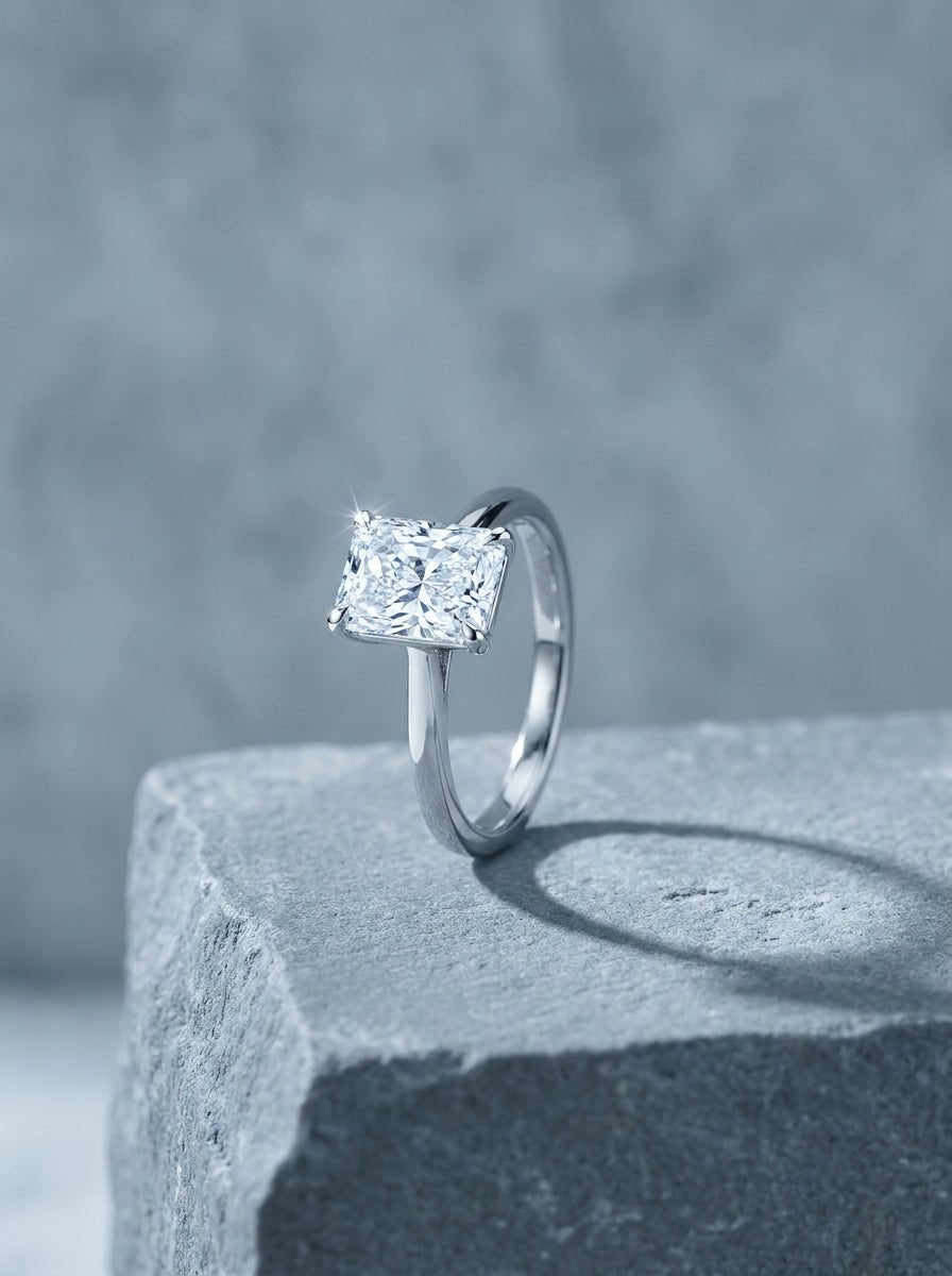 White gold solitaire ring with a radiant cut diamond