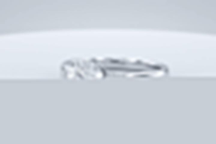 A white gold engagement ring with a round center stone